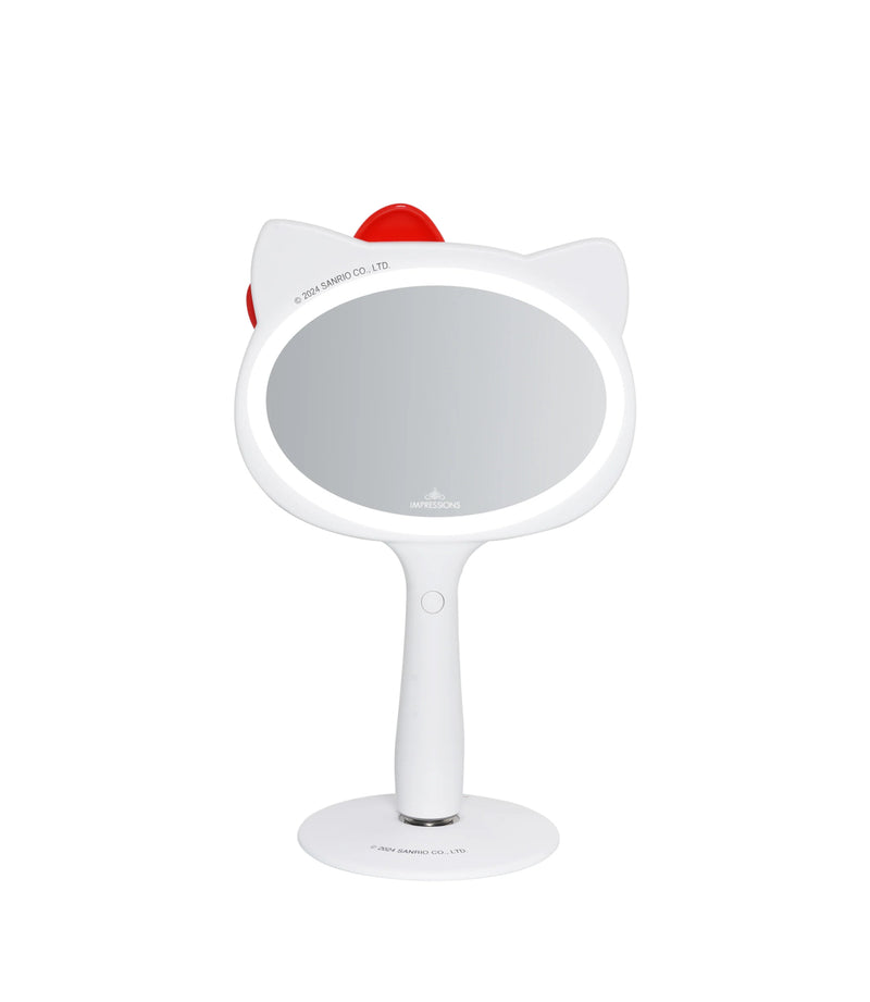 Load image into Gallery viewer, Novelties- Impressions Hello Kitty LED Handheld Makeup Mirror with Standing Base IVMM-HKLV201-WHT (1pc)
